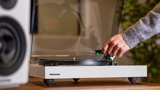 Fluance RT81+ PR image showing stylus being placed on vinyl