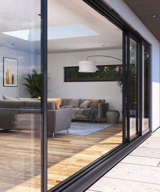 Open glass sliding patio doors on a modern home extension