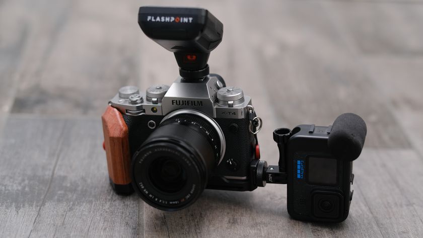 A GoPro sits mounted sidewise on a Fujifilm X-T4
