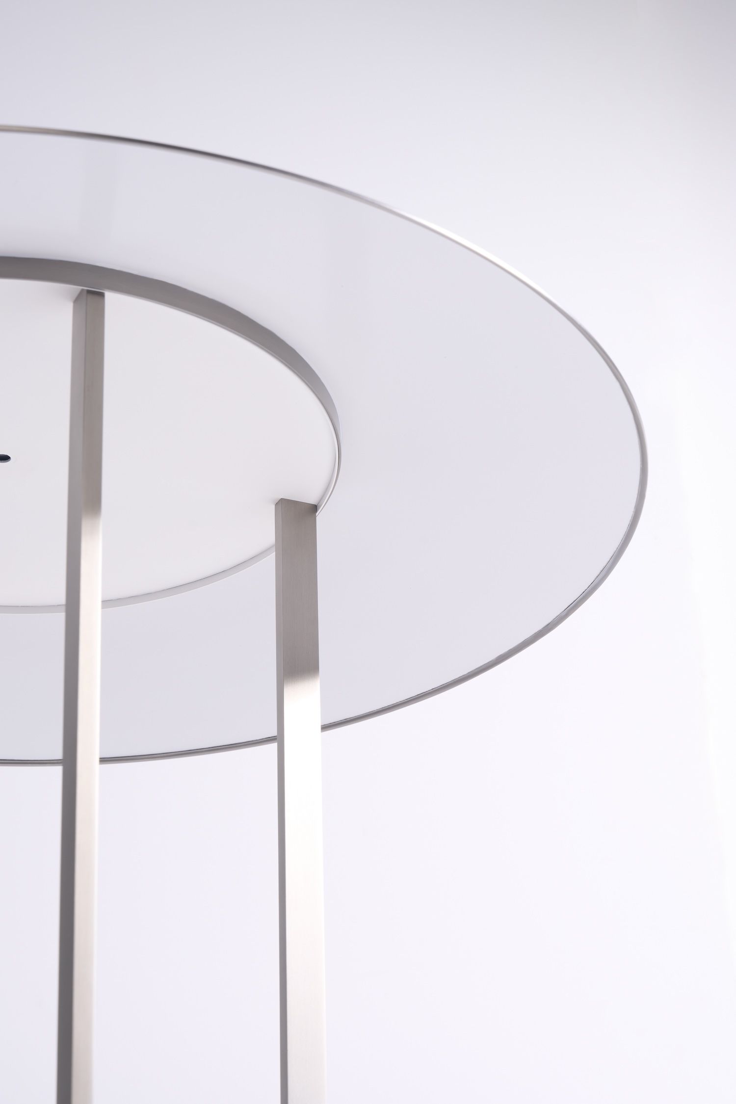 An image of the underside of the Philip Johnson lamp, in stainless steel.