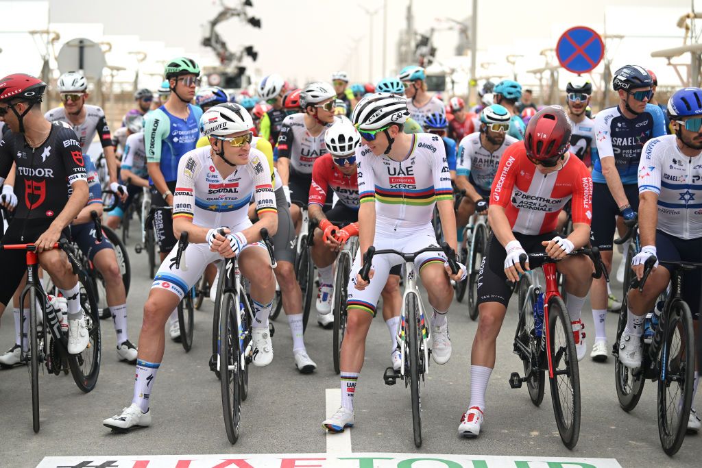 MADINAT ZAYED SHAMS SOLAR PARK ABU DHABI UNITED ARAB EMIRATES FEBRUARY 17 LR Tim Merlier of Belgium and Team Soudal QuickStep Tadej Pogacar of Slovenia and UAE Team Emirates and Rasmus Soejberg Pedersen of Denmark and Decathlon AG2R La Mondiale Team prior to the 7th UAE Tour Stage 1 a 138km stage from Madinat Zayed Shams Solar Park to Liwa Palace UCIWWT on February 17 2025 in Abu Dhabi United Arab Emirates Photo by Dario BelingheriGetty Images