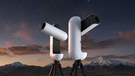 A Vaonis Vespera III next to a Vaonis Vespera Pro II against a starry mountain backdrop.