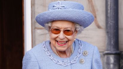 Queen proves she isn't "all stiff upper lip", seen here attending the Queen's Body Guard for Scotland 