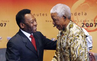 Brazilian football legend Pele (L) shakes hands 17 July 2007 with former South African President, Nelson Mandela in Johannesburg, South Africa. Pele is in South Africa to attend the "90 Minutes for Mandela" match, to be played at Newlands Stadium in Cape Town on 18 July. The match is part of festivities honouring Mandela, who turns 89 on 18 July.