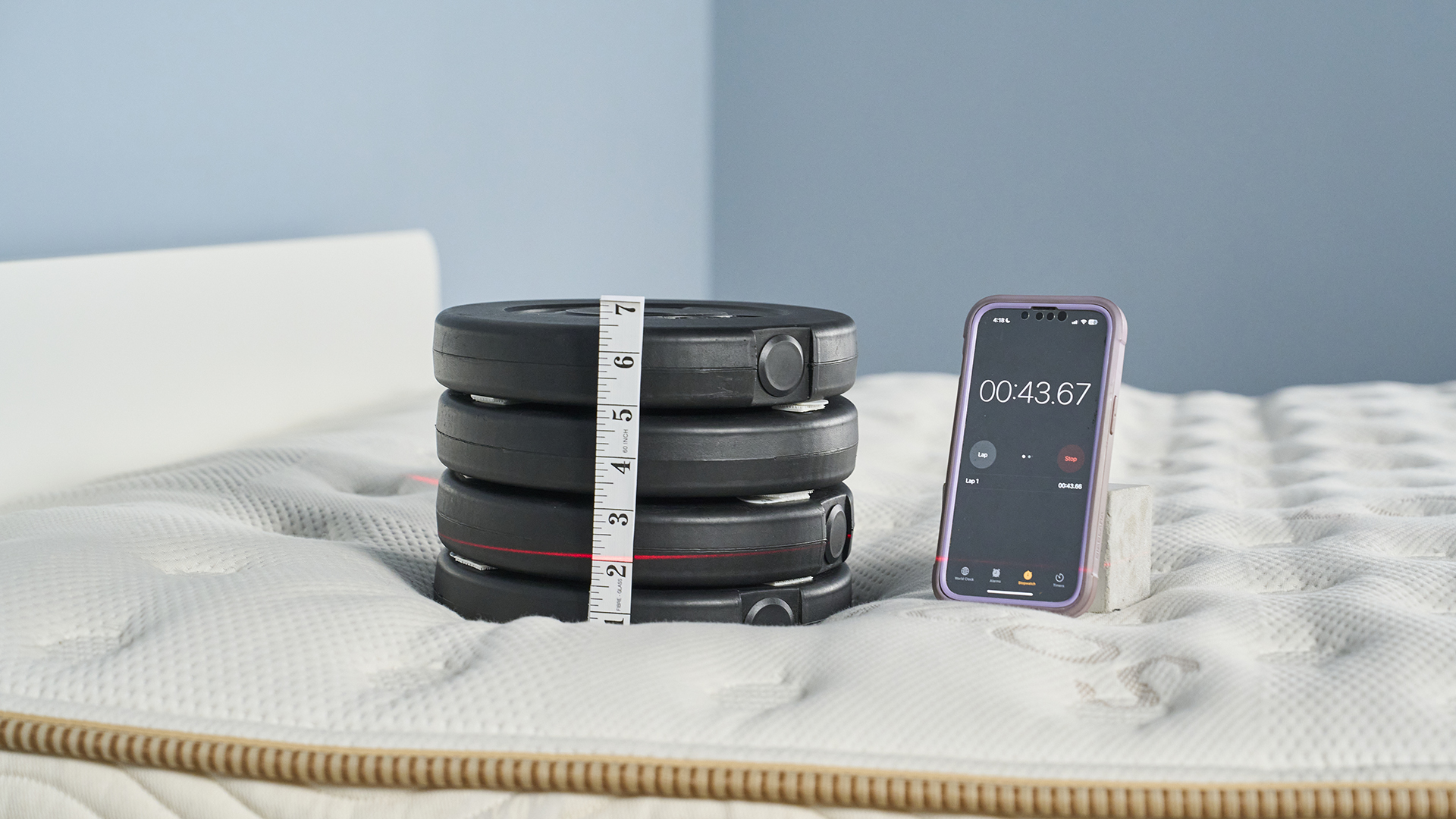 Pressure relief test on the Saatva Classic mattress using a 10kg weight stack