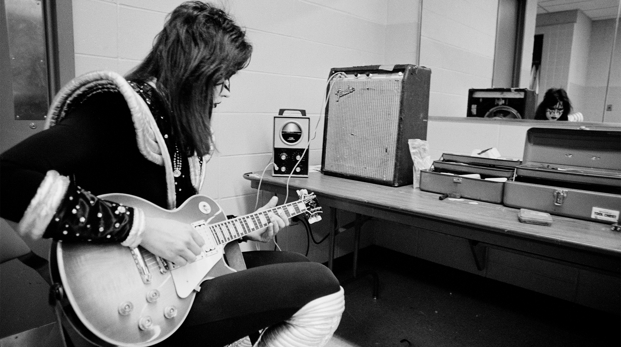 Guitarist Ace Frehley of American heavy metal group Kiss, practising backstage during the band's Rock & Roll Over tour, New York, February 1977.