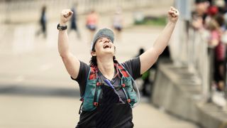 emotional image of woman finishing marathon