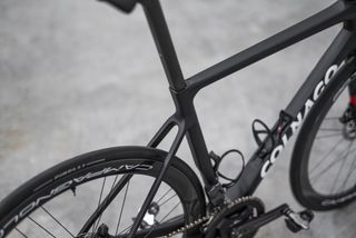 A black Colnago Prototipo in a warehouse