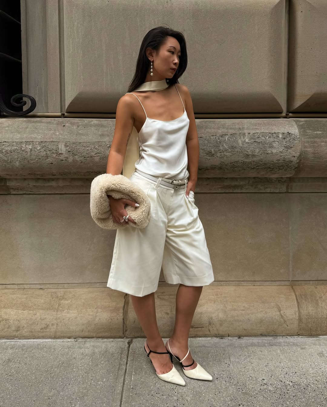 Caroline in silk camisole, scarf and Bermuda shorts