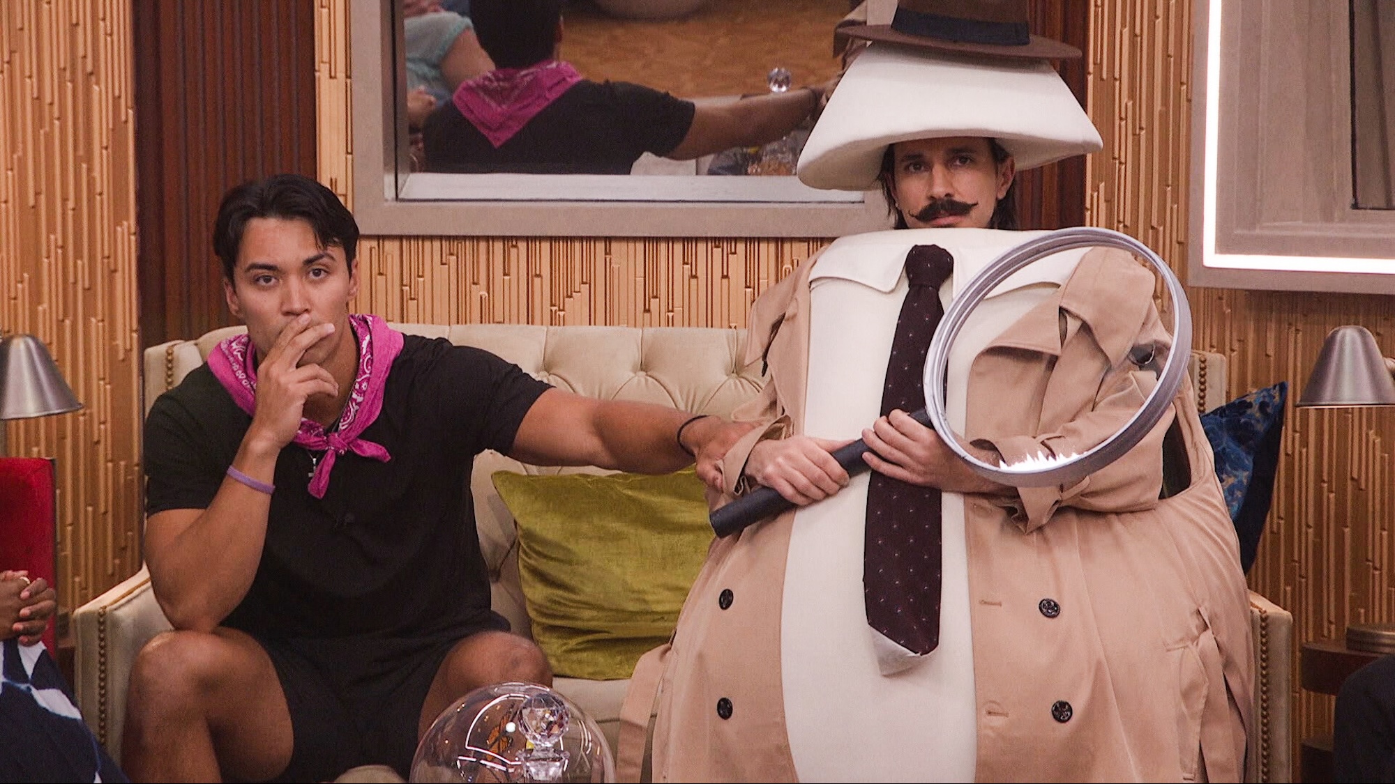 Vince in his egg detective costume standing next to Zach in Big Brother