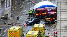 Police search the scene of car attack in Liverpool, England