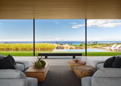 Hawaii house by oslon kundig and leverone design by the sea, tall ceilings, contemporary spaces and art work, and lots of glazing