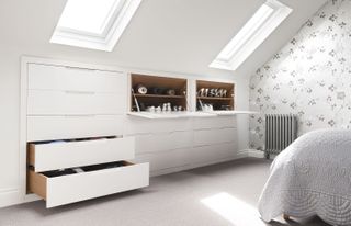 Drawers and shoe cupboards used as storage in a loft bedroom