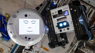 The CIMON space robot meets his colleague, the AstroBee on the International Space Station.