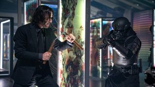 John Wick prepares to attack an enemy in John Wick: Chapter 4