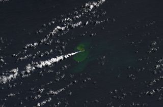An image taken by the Landsat 9 satellite on Sept. 14, 2022, showing a volcanic eruption creating a small island at Home Reef in Tonga.