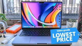 14-inch MacBook Pro M1 Pro on a desk with a Tom's Guide deal tag