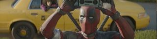 Deadpool holding his cellphone up in Deadpool 2