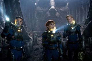 Logan Marshall-Green, left, Noomi Rapace, and Michael Fassbender explore a planet in the darkest corners of the universe, in "Prometheus." Opening date: June 8, 2012.