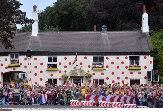 A polka dot pained house during stage 2
