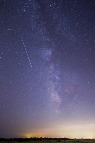 Photographer Chris Bakley captured this spectacular photo of a Perseid meteor streaking over Cape May, New Jersey during the Perseid meteor shower's peak on Aug. 12, 2015.