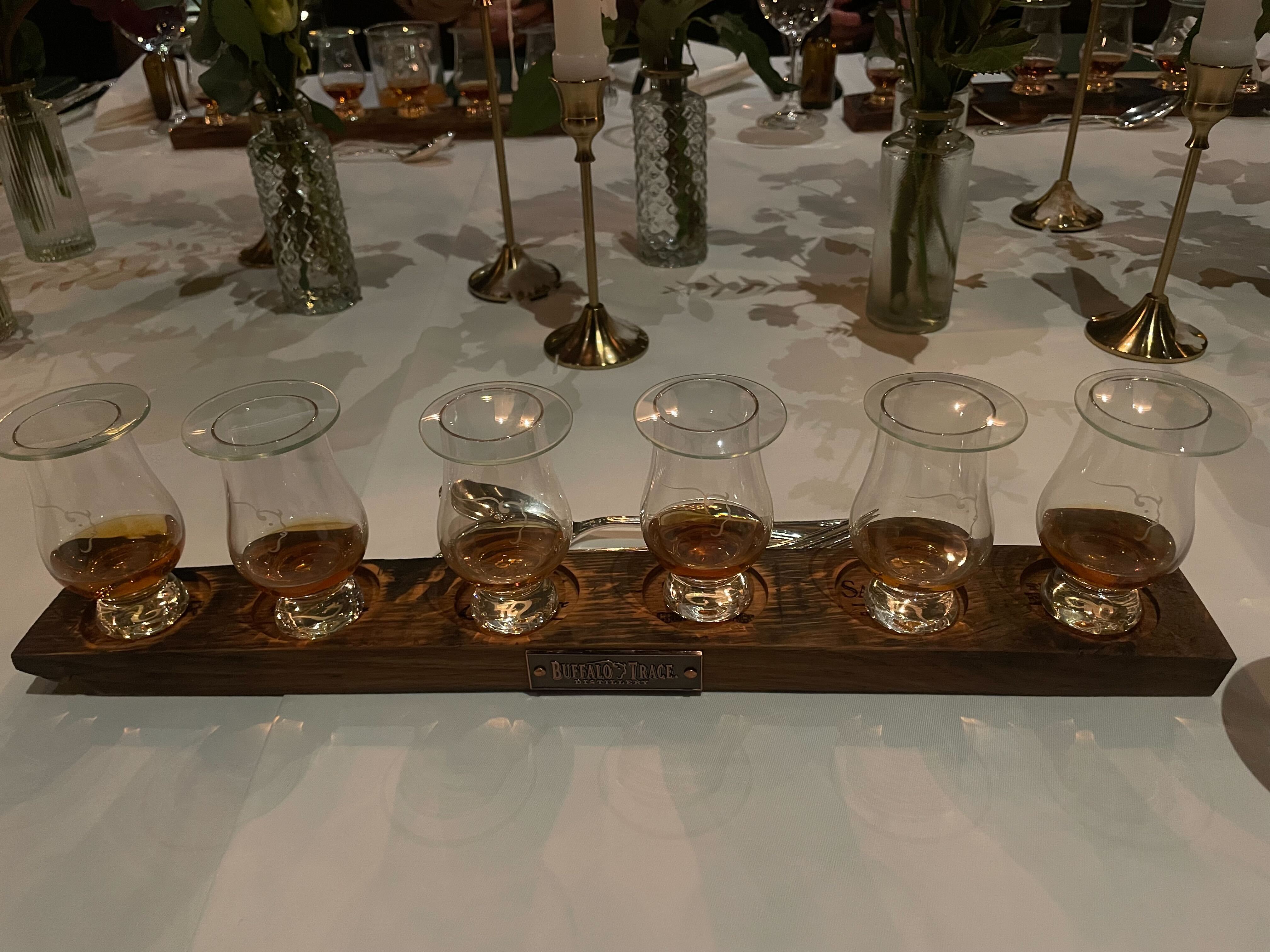 an image of all six drams in the antique collection in tasting glasses