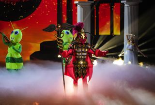 Cockroach performing in The Masked Singer: I'm A Celebrity Special