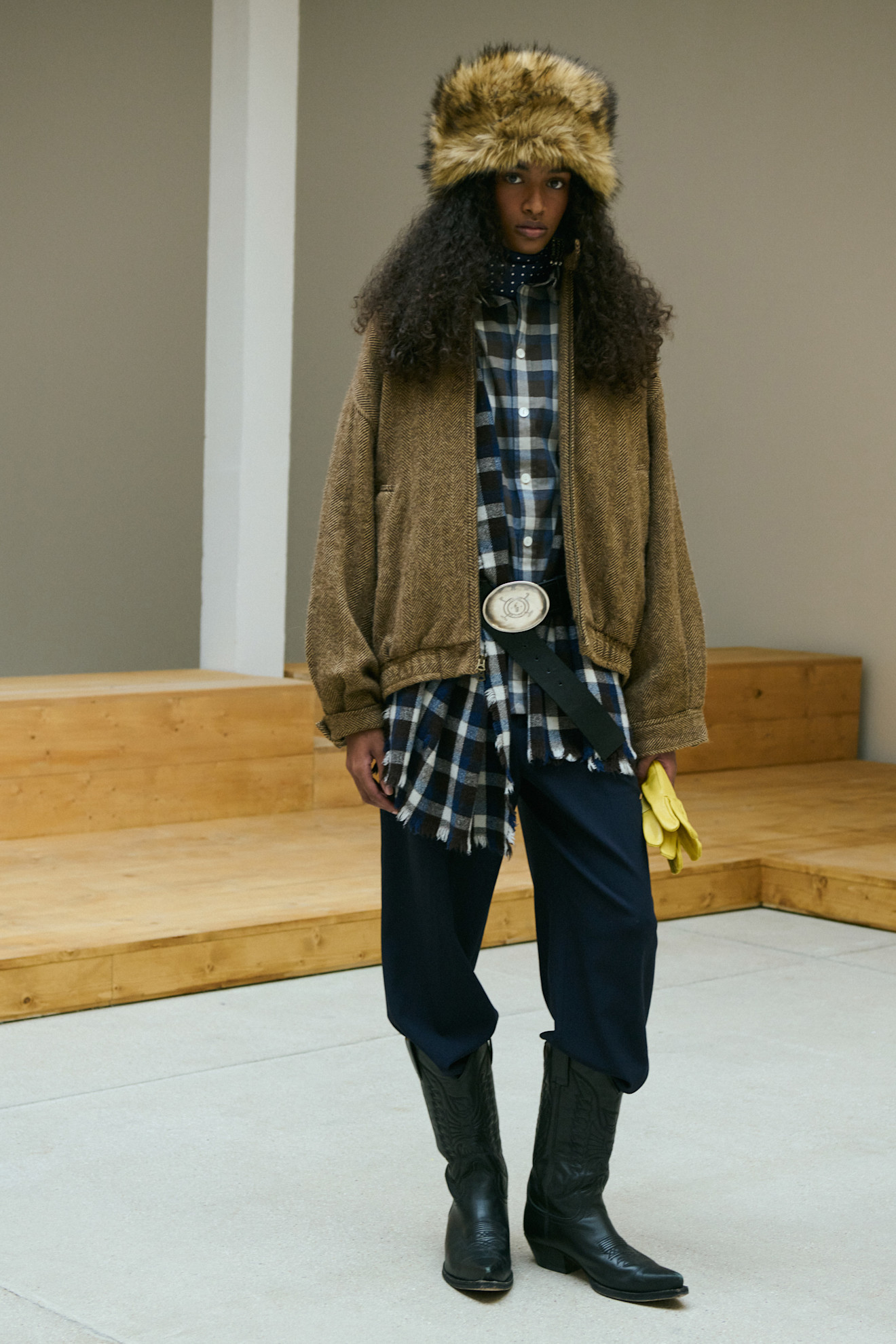 A model wore a flannel shirt during Polo Ralph Lauren's Fall 2026 fashion show