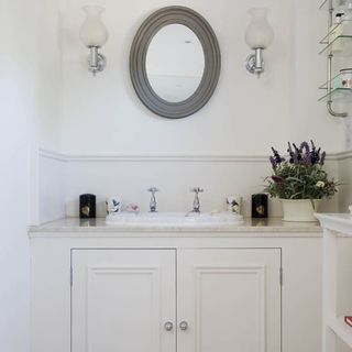 wash room with white cupboard