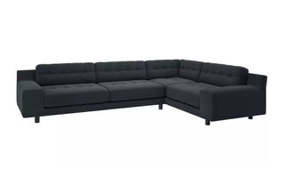 A large corner sofa in grey velvet upholstery