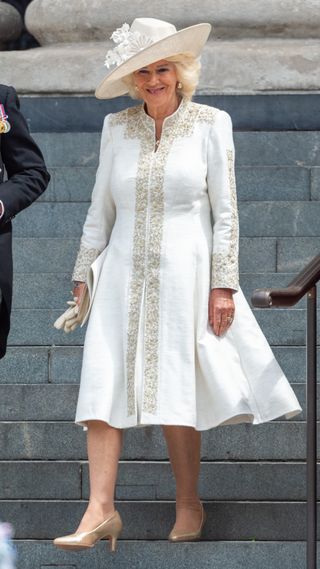Queen Camilla in an embroidered white dress