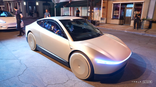 A Cybercab vehicle takes passengers at Tesla&#039;s We, Robot event.