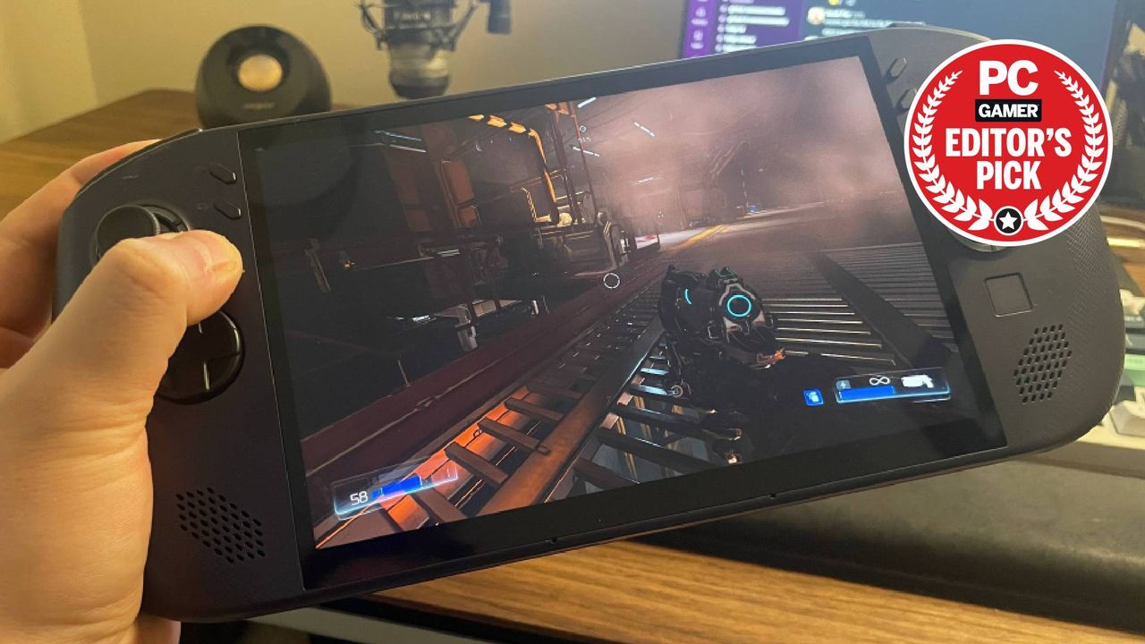 Lenovo Legion Go S SteamOS handheld gaming PC being held in-hand, with a PC Gamer Editor's Pick label on the top-right