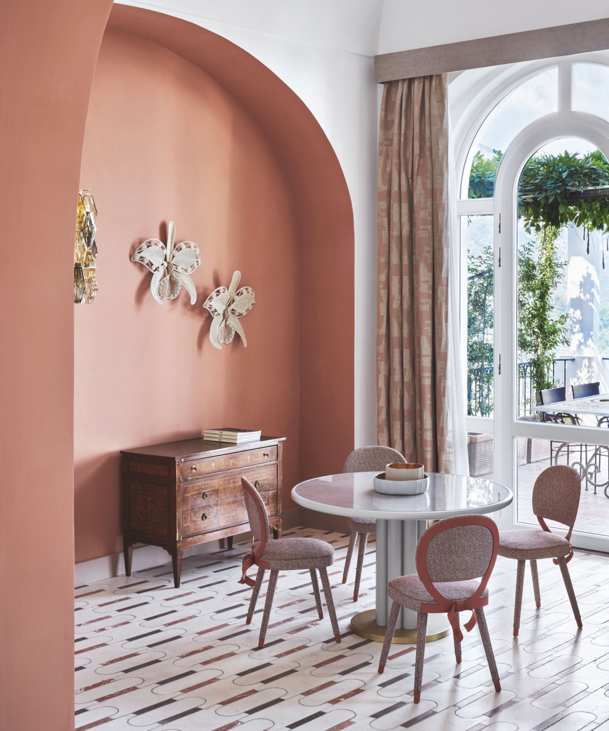 Palazzo Avino dining room in terracotta with terrace beyond