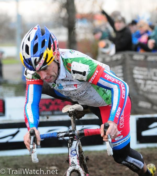 Tim Johnson (Cannondale-Cyclocrossworld.com) remounting his bike after the barriers
