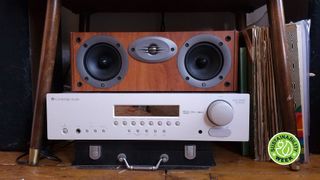 A Cambridge Audio receiver and Rotel center channel, on a hi-fi listening rack with TR's Sustainability Week badge