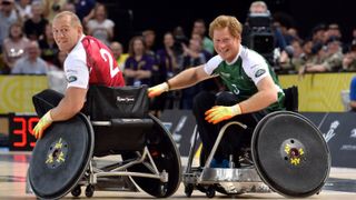 Mike Tindall and Prince Harry in action today during an exhibition match of wheelchair rugby at the Invictus Games at Copperbox, Queen Elizabeth Park on September 12, 2014 in London, England.