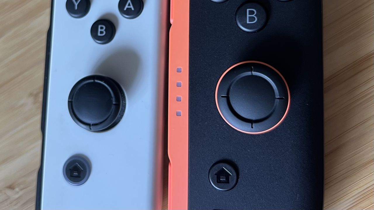 Close up on thumbsticks of Nintendo Switch 2 and Nintendo Switch OLED side by side