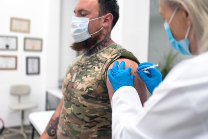 Soldier receiving vaccine