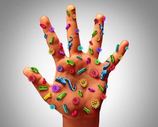 An artist's image of germs on the human hand.