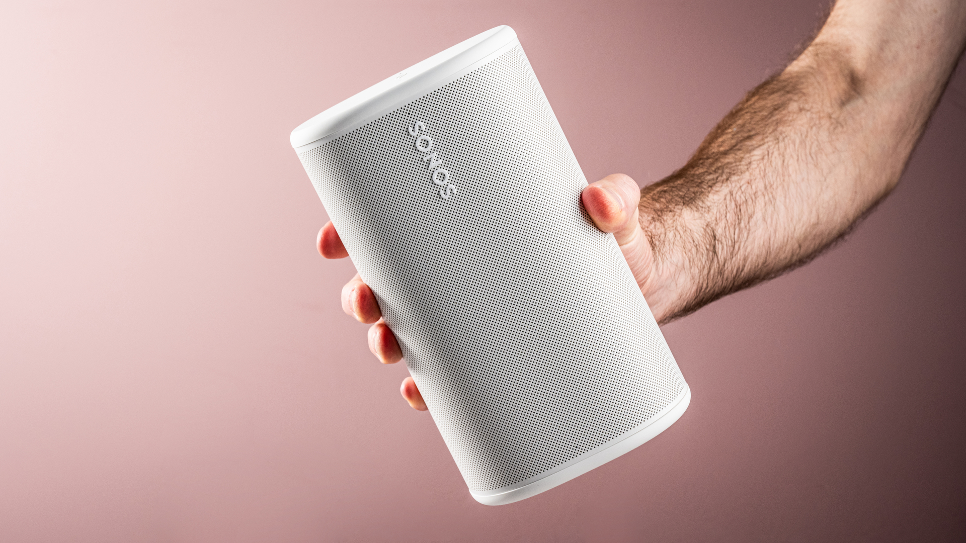 The Sonos Play speaker held in a man's hand