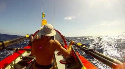 John Beeden rows in the Pacific Ocean.