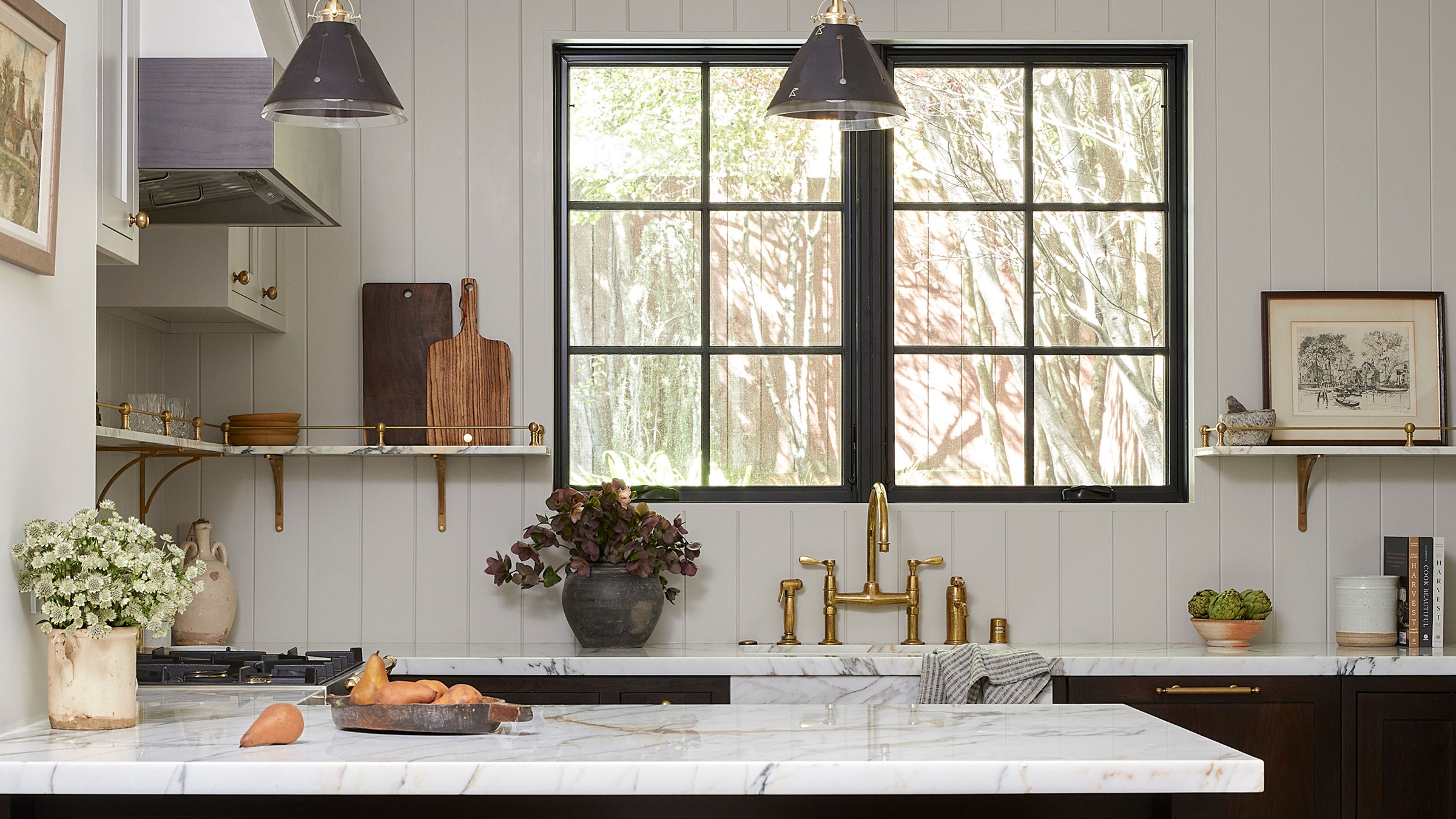 White kitchen with marble top and dark cabinets