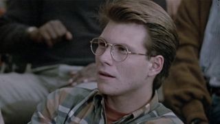 Christian Slater weaing glasses and looking a little confused in Pump Up The Volume
