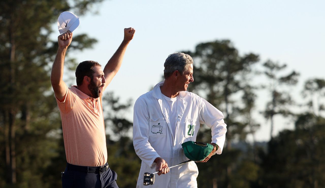 Scottie Scheffler celebrates with his caddie 