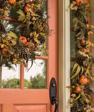 fall wreath and garland on pink door