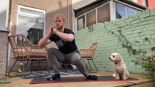 Fit&Well fitness writer Harry Bullmore performing a squat with internal rotation