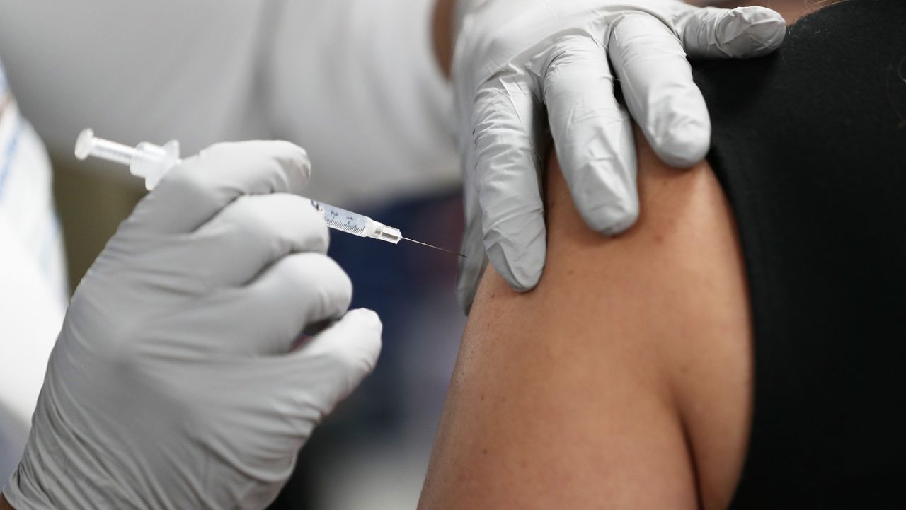 A Covid vaccine is administered