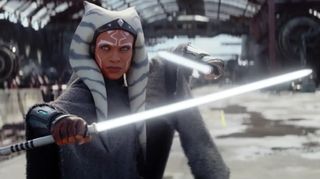 scene from 'Star Wars: Ahsoka' showing rosario dawson's character holding a light saber