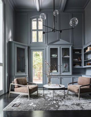 A dark blue grey living room
